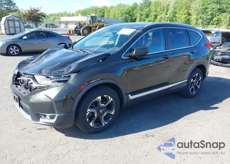 2018 Honda Cr-V Touring z USA, uszkodzony, nr VIN 7FARW2H91JE088570